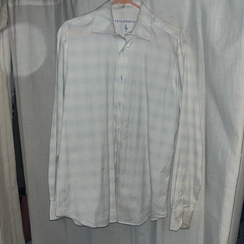 White with little light blue stripes. Men’s button down
